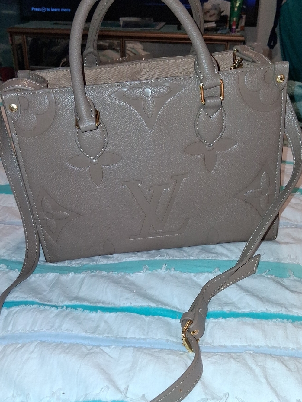 Taupe Embossed Monogram Purse  with Gold Hardware . Sold As Is